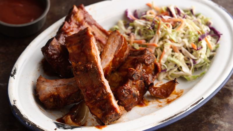 Slow-Cooker Barbecued Ribs prepared recipe on a plate served with coleslaw 