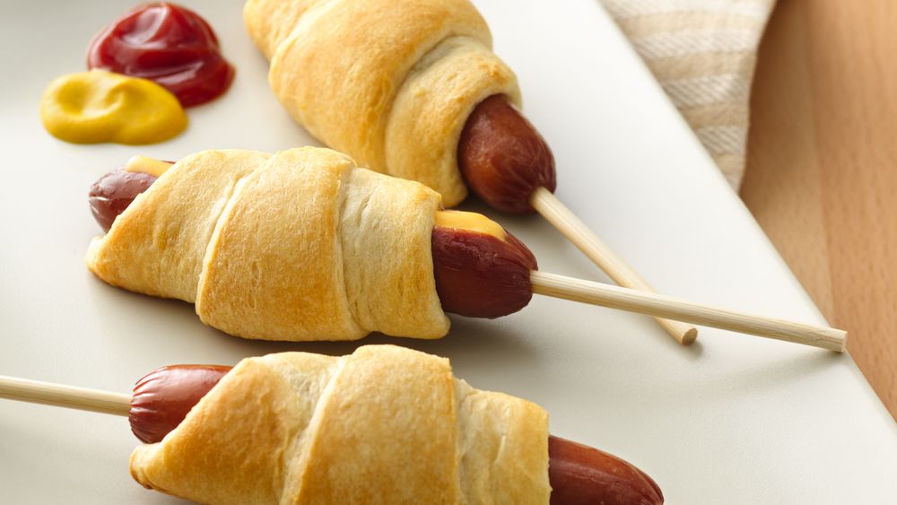 Hot dogs wrapped in pillsbury crescent rolls