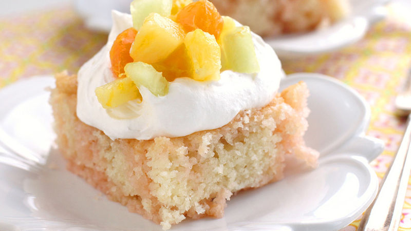 peach mango sunrise poke cake recipe bettycrocker com